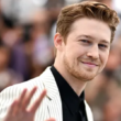 : Actor Joe Alwyn speaks candidly about his six-year relationship with Taylor Swift, reflecting on its depth and navigating their breakup in the public eye.